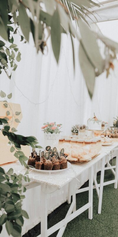 A beautifully arranged dessert table with various treats suitable for celebrations.